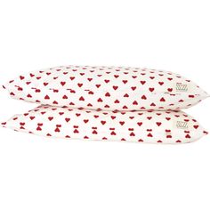 two pillows with hearts printed on them, one is white and the other is red