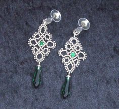 Soft as lace, but made of beads Emerald green crystal and drop add some colour to these lovelies The total length is 6.5 cm Green Drop Crystal Earrings For Party, Elegant Green Beaded Drop Earrings, Green Crystal Pierced Earrings For Party, Elegant Green Beaded Crystal Earrings, Green Teardrop Beaded Earrings For Party, Green Beaded Earrings With Dangling Beads For Wedding, Green Beaded Evening Jewelry, Green Beaded Chandelier Earrings For Wedding, Elegant Green Dangle Beaded Earrings