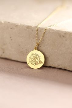 Gold Compass Pendant - Mountain Gold Necklace ● Material of pendant: Solid Gold 14k ( REAL GOLD ) ● Metal Stamp: 14k ( REAL GOLD ) ● The pendant is available in 5 sizes: - 12,7 mm / 0.5 inches (Diameter) - 14,0 mm / 0,55 inches ( Diameter ) In the photos - 15,3 mm / 0.6 inches ( Diameter ) - 16,5 mm / 0,65 inches ( Diameter ) - 19,1 mm / 0,75 inches ( Diameter ) ( In the photos the size is 14mm / 0.55 inches Diameter ) ( Jump Ring inner diameter: 4 mm ) ● Material of chain: Solid gold 14k ( REAL Engraved Medallion Necklace For Travel, Gold Medallion Necklace As Souvenir, Gold Medallion Necklace For Souvenir, Personalized Pendant Necklaces For Travel, Personalized Gold Jewelry For Travel, Personalized Gold Necklace For Travel, Gold Medallion Jewelry For Travel, Gold Engraved Jewelry For Travel, Travel Engraved Gold Jewelry