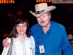 a man and woman standing next to each other