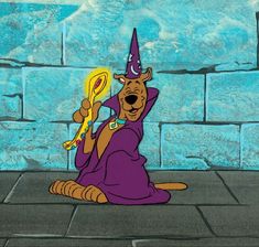 a cartoon character sitting on the ground with a wand in his hand and wearing a purple outfit