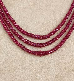 Genuine Red Ruby 3 mm - 4 mm faceted Rondelle Beaded Necklace 3 String Ruby Necklace Natural Ruby Jewelry Could be Perfect Gift for your close one on this Fastive season Ruby Gemstone Beaded Necklace (4 Strands) Excellent faceted Gems Natural :Natural Gemstones Origin : Longido ( Arusha Region in Tanzania ) GENUINE : 100% Stone Weight : approx 170 carat Size : approx 3 - 4 mm beads Strand Length : approx 15.00 inches smallest approx 16.50 inches Longest Country/Region of Manufacture :India Good Ruby Necklaces With Round Faceted Beads, Round Ruby Necklaces With Faceted Beads, Round Ruby Necklace With Faceted Beads, Red Faceted Rondelle Beaded Necklaces, Faceted Ruby Round Bead Necklaces, Red Rondelle Jewelry With Faceted Beads, Red Faceted Rondelle Necklaces, Red Rondelle Beads Jewelry With Faceted Detail, Faceted Rondelle Ruby Jewelry