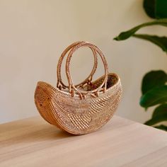 Bali Rattan Boat Clutch handmade by Ganapati Crafts Co. in Bali is the perfect accessory for any stylish woman Rattan Bags, Rattan Style, Well Woven, Clothes Hooks, Rattan Bag, Clean Cotton, Coconut Shell, Buy Handmade, Perfect Bag