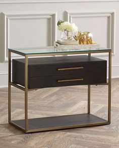 a table with a glass top and two drawers