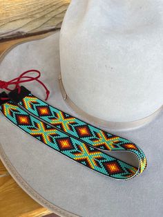 Handmade hatband! Handmade Adjustable Hat Bands For Rodeo, Custom Adjustable Hat Bands For Festivals, Handmade Adjustable Band Headband, Adjustable Multicolor Hat Bands For Rodeo, Handmade Artisan Adjustable Hat Bands, Handmade Flat Crown Hat Bands For Rodeo, Southwestern Style Hat Bands For Festival With Flat Crown, Southwestern Hat Bands For Festival With Flat Crown, Handmade Multicolor Hat Bands For Rodeo