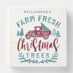 a wooden block with the words farm fresh christmas trees and an old truck on it