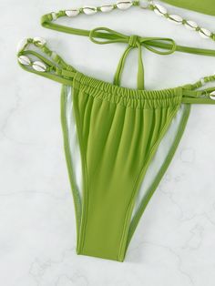 Looking for the perfect bikini set to add flair to your beach look? This women's halter bandage cross swimwear is the answer. Made with high-quality polyester and spandex, it offers comfort and durability. The push-up feature enhances curves, while the breathtaking solid pattern and vibrant color give it a stylish look. Glorify your style on the beach without breaking the bank.Specifications With Pad: Yes Waist: Low Waist Support Type: Wire Free Style: Elegant fashion Pattern Type: Solid,Print O Mermaid Swimsuit, Triangle Swimsuit, Fashion Office, Shell Design, Women Halter, Beach Swimsuit, Fashion Pattern, Lingerie Collection, Swimwear Fashion