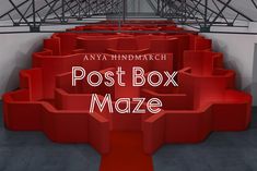 there is a red box with the words post box maze on it in front of an empty room