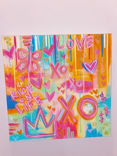 an abstract painting with the words love and xoxo painted on it