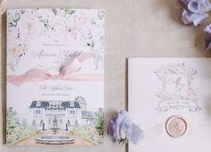 the wedding stationery is laid out on the floor