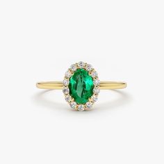 Emerald Ring / 14k Classic Oval Cut Emerald Ring with Surrounding Diamonds / Natural Emerald Ring in 14k Solid Gold / Mothers Day Gift Item Features * Made to Order. * Gold KT: 14K * Custom Gold Color: Rose Gold, Yellow Gold, White Gold * Number of Emeralds and Size : 1 Oval Emerald 6x4MM in Size * Number of Diamonds:  14 Round diamonds 1.30MM in Size * Total Emerald CTW: 0.40ctw * Total Diamond CTW: 0.15ctw * Diamond Color Clarity: G Color SI Clarity * Setting Type: Prong * Band Width: 1.25mm * Ready to Ship in 7-10 Business Days ▶ See more of our Emerald Jewelry - https://etsy.me/3QCyZBQ ▶ See our storefront here - http://etsy.me/2lUcVnH  ▶ All store sections here * Diamond Rings - http://etsy.me/2lwKUl8 * Diamond Earrings - http://etsy.me/2lyqVBP * Diamond Necklace - http://etsy.me/2mqa 14k Yellow Gold Cluster Ring With Oval Shape, 14k Yellow Gold Diamond Ring Oval Cabochon, 14k Gold Emerald-cut Halo Cluster Ring, 14k Gold Emerald-cut Cluster Ring With Halo Design, 14k Gold Emerald Cut Cluster Ring With Halo Design, 14k Gold Emerald Cut Halo Setting Ring, 14k Gold Emerald Cut Halo Cluster Ring, Classic Yellow Gold Emerald Ring With Halo, Heirloom Yellow Gold Diamond Ring With Oval Cabochon