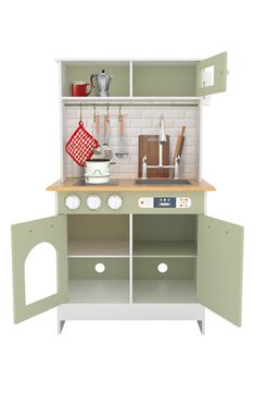 a toy kitchen with green cabinets and white walls