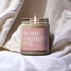 a candle that reads in my engaged era