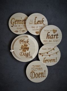 four wooden coasters with different sayings and pictures on the front one says,