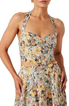 Tap into garden party style with this bustier top cut in a modern cropped silhouette. Halter neck Sleeveless 70% viscose, 30% nylon Dry clean Imported Chic Spring Tank Top With Removable Bra Pads, Fitted Halter Neck Top For Brunch, Spring Bandeau Halter Top For Summer, Fitted Strapless Crop Top For Brunch, Fitted Bandeau Halter Top For Spring, Summer Cropped Tube Top With Built-in Bra, Cropped Tube Top With Built-in Bra For Summer, Fitted Floral Print Halter Neck Tank Top, Fitted Halter Neck Tank Top With Floral Print