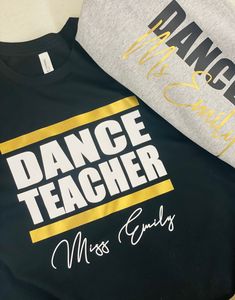 Treat your favorite DANCE TEACHER to our personalized Dance Teacher luxe cotton t-shirt. This long sleeve t-shirt comes in a variety of colors and printed with DANCE TEACHER on the front and your studio name or dance teacher name below.  Our super soft luxe cotton t-shirt is made of 100% cotton. Available in white, black, and navy with DANCE TEACHER printed in between 2 metallic gold lines and perfectly personalized with the name of your choice. Machine Wash Cold - Tumble Dry Low Please no retur Dance Studio Shirts Design, Dance Teacher Shirts Design, Dance Teacher Shirt, Dance Teacher Shirts, Dance Teacher Outfits, Teacher Tshirts Designs, Dance Teacher Gifts, Dance Mom, Cute Shirt Designs