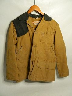 Vintage Trailblazzer Winchester Sportswear Tan Canvas Duck Hunting Jacket Sz 44 Condition: Preowned  • There are stains on the front below the bottom button. Light stains on the back of the jacket. There is a hole in the back of the jacket in the center near the bottom. Comes from a clean, smoke free home! Please examine ALL photos carefully. Returns are accepted  within 30 days  of buyer receiving item. Buyer is responsible for return shipping.  We ship internationally     It is important to us Vintage Long Sleeve Hunting Outerwear, Vintage Hooded Hunting Outerwear, Vintage Hooded Outerwear For Hunting, Brown Cotton Sport Coat, Casual Long Sleeve Hunting Sport Coat, Brown Long-sleeved Cotton Sport Coat, Casual Long Sleeve Sport Coat For Hunting, Brown Cotton Long Sleeve Sport Coat, Vintage Long Sleeve Sport Coat For Outdoor