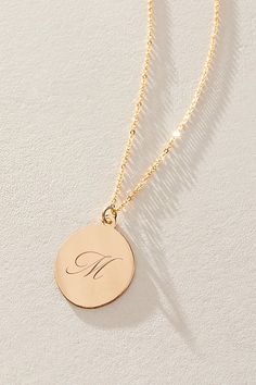 Just as effortless as it is elegant, this stunning necklace features an oval pendant with gorgeous cursive engraved initial for the ideal finishing touch. * 14k Gold Filled chain * Personalized, laser engraved, 14k Gold Filled 17x22mm oval pendant * Length: 20" * 5 days of production | Set & Stones Personalized Amelia Necklace at Free People in Gold Elegant Initial Pendant Necklace For Mother's Day, Elegant Wedding Initial Necklace, Elegant Initial Pendant Charm Necklace For Wedding, Elegant Oval Pendant Charm Necklaces, Tarnish Resistant, Elegant Oval Pendant Charm Necklace That Is Tarnish Resistant, Elegant Oval Charm Necklaces For Anniversary, Elegant Oval Pendant Charm Necklaces For Anniversary, Elegant Oval Pendant Charm Necklace, Tarnish Resistant, Classic Necklace With Engraving Option