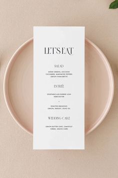 a table setting with a menu card on it