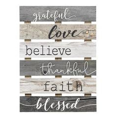 a wooden sign that says grateful love, believe, thank and faith