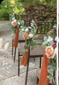 the chairs are decorated with flowers and greenery for an outdoor wedding ceremony or reception