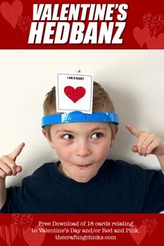 a young boy wearing a valentine's headband with the words i am heart on it