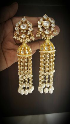 *It's Handmade Indian Ethnic Kundan Earrings. *It's made from Silver n Copper with White Kundan Stones Settings and Pearl Drops with 22k gold Plating as shown in picture. *It it Pure Ethnic Look with Ethnic Touch and 3.5 inches Long. *Our all jewelry is made from semiprecious stones and beads. *WARRANTY: ITS GENUINE HANDMADE JEWELRY AND WE ARE GIVING LONG LIFE WARRANTY FOR OUR ALL ITEMS. All of our Kundan Jewelry is 100% handmade with ancient Kundan stone setting method using silver foils. It is Luxury Kundan Dangle Danglers, Temple Jewelry Style Bridal Earrings With Latkans, Temple Jewelry Bridal Earrings With Latkans, Latkans Earrings For Wedding And Navratri, Traditional Chandelier Earrings With Latkans For Diwali, Temple Jewelry Bridal Earrings With Latkans For Celebration, Kundan Pearl Earrings For Festivals And Celebrations, Festive Temple Jewelry Pearl Earrings With Latkans, Temple Jewelry Earrings For Eid Celebrations