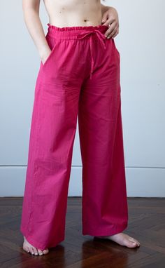 Our wide leg cotton voile pajama pants are so comfortable you'll forget that you're wearing them. Designed with an easy fit elasticized waist and a full leg for maximum comfort. The soft cotton is perfect for sleeping in or just lounging around. Wear them with a simple cotton t-shirt or the matching top (sold separately) and you will be be the best dressed person in your dreams. ♦︎ Fabric: 100% Cotton Voile ♦︎ Softly elasticzied drawstring paperbag waist ♦︎ Two front slash pockets ♦︎ Please note Cotton Pants For Summer Pajama Party, Pink Relaxed Fit Wide Leg Parachute Pants, Pink Wide Leg Parachute Pants With Relaxed Fit, Pink Wide-leg Parachute Pants For Summer, Pink Wide Leg Parachute Pants For Summer, Comfortable Wide Leg Pants For Pajama Party, Summer Cotton Wide Leg Parachute Pants, Pink Cotton Parachute Pants With Relaxed Fit, Cotton Wide Leg Bottoms For Pajama Party