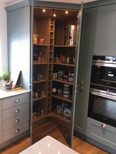 an open pantry with lots of food in it