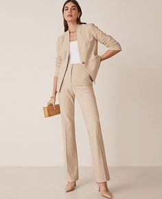 Elevate your wardrobe with the Ann Taylor Petite High Rise Skinny Trouser Pant in Bi-Stretch, a perfect blend of style and comfort. These trousers are meticulously tailored to flatter your figure while providing all-day comfort, thanks to their refined four-way stretch fabric.

- **Size:** Petite 12
- **Color:** Toasted Oat
- **Material:** 66% Polyester, 28% Rayon, 6% Spandex
- **Gender:** Female
- **Fit:** Tailored and fitted
- **Rise:** High rise, sits 1/2" to 1" below natural waist
- **Leg Sh Womens Tan Suit Work Outfits, Women’s Work Attire, Women’s Trousers, Khaki Suit Women, Women’s Suits, Style Seasons, Salon Photoshoot, Chic Business Attire, Business Professional Women