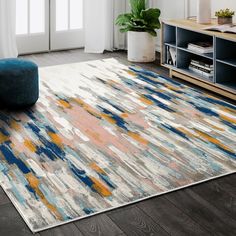 an area rug with various colors and shapes