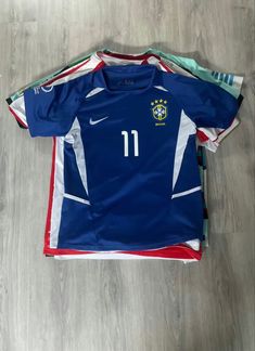 the soccer jersey is laying on the floor