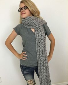 a woman wearing glasses and a scarf