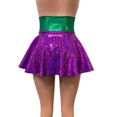 Our newest skirt style! We are in love with this lace-up, open-front mini skirt in purple and green holographic spandex with gold ties/laces. The tie-up front offers an adjustable fit and the skirt is light and airy.This mardi gras corset skirt is perfect for your party or event! The gold holographic cheeky shown in the photo is sold separately in our shop. Spring Party Rave Skirt, Spring Rave Party Skirt, Rave Skirt For Spring Party, Spring Rave Skirt For Party, Rave Style Skirt For Spring Party, Rave Mini Skirt For Spring, Rave Style Mini Skirt For Night Out, Fitted Pink Skirt For Festival, Fitted Flared Skort For Party