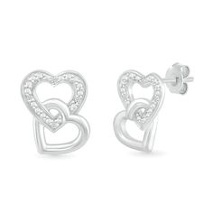 Capture a charming new style with the playful details of these diamond accent double interlocked heart stud earrings. Crafted in sterling silver Each earring showcases a heart-shaped outline shimmering with diamond accents and beaded details. A polished open heart interlocks at the bottom in a playful tilted design. These post earrings secure comfortably with friction backs. Fine Jewelry Double Heart Earrings For Valentine's Day, Sterling Silver Double Heart Earrings, Valentine's Day Fine Jewelry Double Heart Earrings, White Gold Double Heart Earrings For Pierced Ears, Silver Heart Beads Earrings For Anniversary, White Gold Double Heart Diamond Earrings, Sterling Silver Double Heart Earrings Fine Jewelry, Double Heart Cubic Zirconia Earrings, Cubic Zirconia Double Heart Earrings