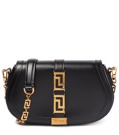 Let us introduce you to the latest it-bag from Versace: the Greca Goddess. Made from calf leather, the compact design has a detachable chain strap and is named for its gold-toned Greca hardware. | Versace Greca Goddess leather shoulder bag Versace Bags Women, Versace Bag, Dream Bags, It Bag, Platform Mules, Versace Bags, Bags Luxury, Luxury Bag, Bag Collection