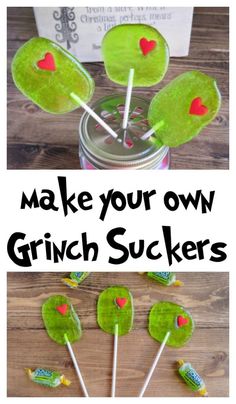 some green lollipops with hearts on them and the words make your own grin sucker