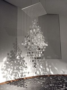 a chandelier hanging from the ceiling in a room