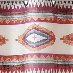 the curtain is decorated with colorful patterns and beads on it's rodo - end