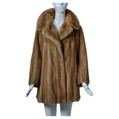 c. 1970 mink jacket in a soft golden shade features a spread collar and comes with a brown leather sash belt. One fur hook and an interior tie keep allow the jacket to be worn with or without the belt. Add your own belt for a unique look. The embroidered lining and fur are in very good condition, no flaws noted. Fits size S. Classic Brown Fur Coat For Formal Occasions, Mink Jacket, Sash Belts, Sash Belt, No Se, Fur Coat, Brown Leather, Fashion Outfits, Collar