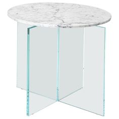 a white marble top table with clear glass legs and an open side panel on the bottom