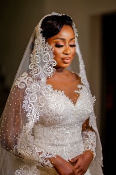 a woman in a wedding dress and veil