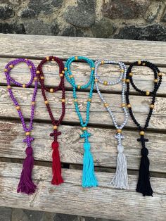 Discover the essence of spiritual devotion with our meticulously crafted Pocket Prayer Rope, available in both 30 and 50 knot variations, each adorned with a delicately braided cross. Our Orthodox Prayer Rope, also known as Komboskini or Chotki, is meticulously crafted to the highest standards. It features a precise distance of 10 knots between wood dividers, ensuring a seamless experience of prayerful meditation. Experience premium quality in every detail - from the tight, expert weaving to the Adjustable Beaded Rosary For Blessing, Adjustable Wooden Beads Spiritual Rosary, Spiritual Beaded Necklaces For Beach, Bohemian Beaded Rosary For Meditation, Meditation Rosary With 108 Beads, Handmade Adjustable Mala For Festivals, Adjustable 108 Beads For Blessing, Adjustable Spiritual Mala For Festivals, Adjustable Hand Knotted Beads For Meditation