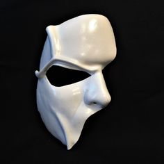 DESCRIPTIONHaunt the Paris Opera House Palais Garnier! You'll steal the stage in this extremely detailed white leather half-face mask is fabulous for theatre productions, masquerade balls, Mime costume or Halloween parties. Waterproofed, so fantastic for outdoor theater, Renaissance Festivals, or Burning Man. Any color. Waterproofed leather, glossy or matte finish, & several choices to affix the mask (cord, elastic, ribbon, waterproof cord, or no holes for adhesive). Measurements: 8" high x Artistic White Masquerade Mask For Halloween, Artistic White Costume Masks And Prosthetics, Artistic White Masks And Prosthetics For Costume, Artistic White Masks For Costumes, Artistic White Costume Mask, White Eye Mask For Cosplay, White Full Face Mask For Cosplay, White Venetian Masks For Theater, Venetian White Mask For Theater