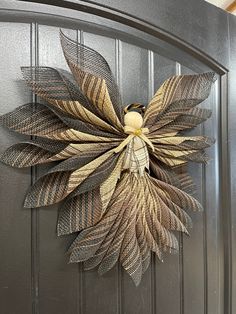 a metal door with a decorative flower on it