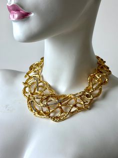 Vintage 90s Elizabeth Taylor For Avon "Treasured Vines" 22k Gold Plated Diamanté Swarovski Crystal Necklace. Stunning Vintage 90s Elizabeth Taylor "Treasured Vines" Necklace. Exquisite Craftsmanship To This Gorgeous Piece. Created in 22K Gold Plating With Rows of Round Cut Diamanté Swarovski Crystals. High Quality Design, Style, and Materials make This Statement Making Necklace Irresistible. Perfect Perfection in an Extraordinary Way. Simply Divine. Has Adjustable Chain With Claw Clasp Closure. Has Weight. Not For The Faint of Heart. 17" Necklace  .75" Lobster Clasp 3" Adjustable Chain SIGNED  Preowned Vintage Condition. Has Lite Vintage Wear/Lite Surface Wear. Has Some Lite Tarnish Where The Links Connect. Great Vintage Condition. Designer Yellow Gold Evening Necklace, Designer Yellow Gold Necklaces For Evening, Designer Yellow Gold Necklace For Evening, Designer Gold Necklaces, Designer Gold Necklaces For Evening, Designer Gold Necklaces For Anniversary, Opulent Gold Evening Necklaces, Opulent Gold Necklaces For Evening, Opulent Gold Evening Necklace