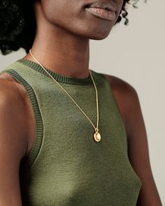 Description A gorgeous big sibling to our beloved Button Pendant, the Button Grand Pendant offers the same delight of pressing that soft center of buttery gold, but on a larger scale. Perfect to layer with different chain lengths and pendants. The finely crafted bail can accommodate our chains without the need of a jump ring, offering a more streamlined and solid feel. Solid gold to the core; never hollow. Its heft will thrill you. Explore the Button Collection. Details Solid 18k yellow gold (no Elegant Pendant Locket Necklace For Everyday, Elegant Everyday Pendant Locket Necklace, Elegant Medallion Locket Necklace In Gold Plated, Elegant Gold-plated Medallion Locket Necklace, Elegant Everyday Coin Pendant Necklace, Elegant Gold Plated Medallion Locket Necklace, Oval Pendant Yellow Gold Medallion Necklace, Elegant Round Coin Necklace With Locket, Gold Plated Medallion Necklace With Large Pendant