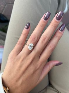 a woman's hand with a ring on it