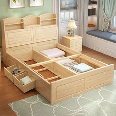 a wooden bed frame with drawers underneath it