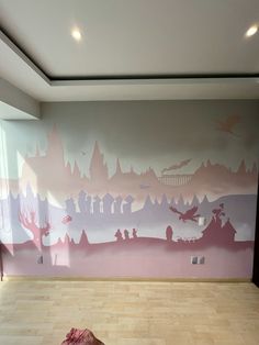 an empty room with pink and purple painted on the walls